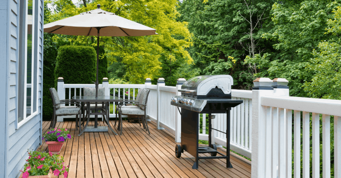 brown deck with white railings installed by professional deck builders