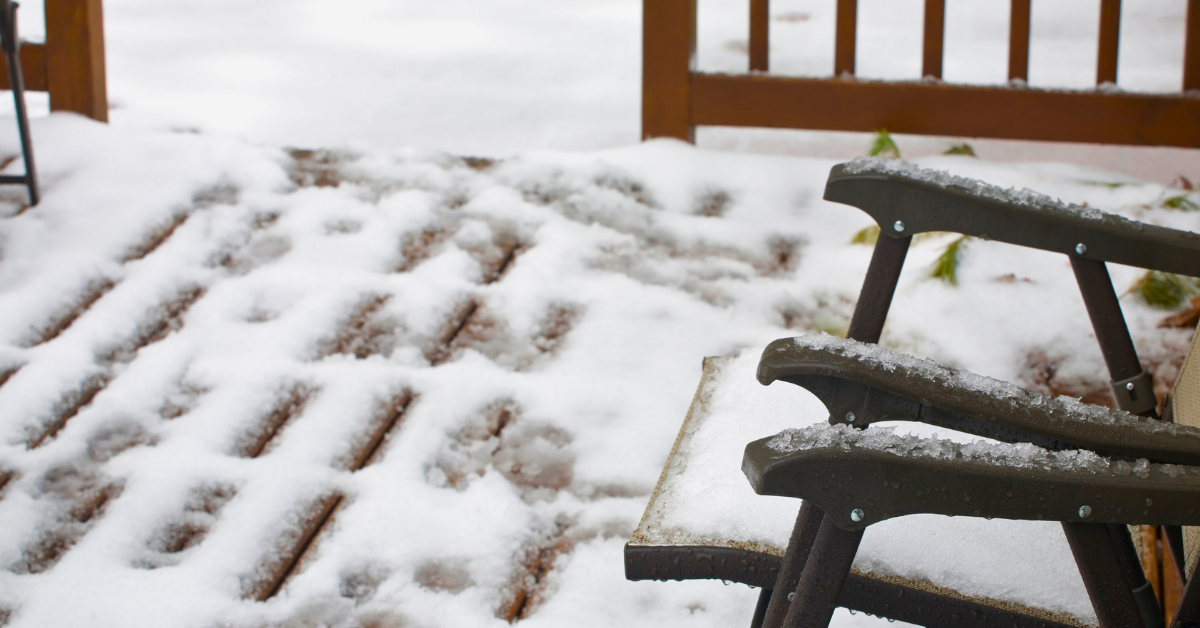 composite decking covered in a layer of wet snow